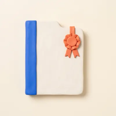 Clay document folder with a coral rosette award ribbon